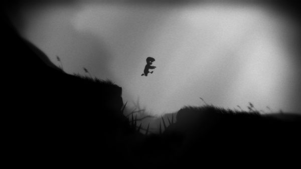 Limbo protagonist leaps a small ravine filled with spikes