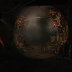 Screenshot from The Last of Us (2013) showing Joel looking down a heavily fungal-infested corridor.